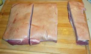 Five pounds of boneless pork belly before the skin is removed