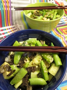 Vegan sushi rice bowl with just raw vegetables: cucumber, avocado, sugar snap peas