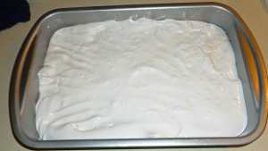 Marshmallows spread evenly in baking pan